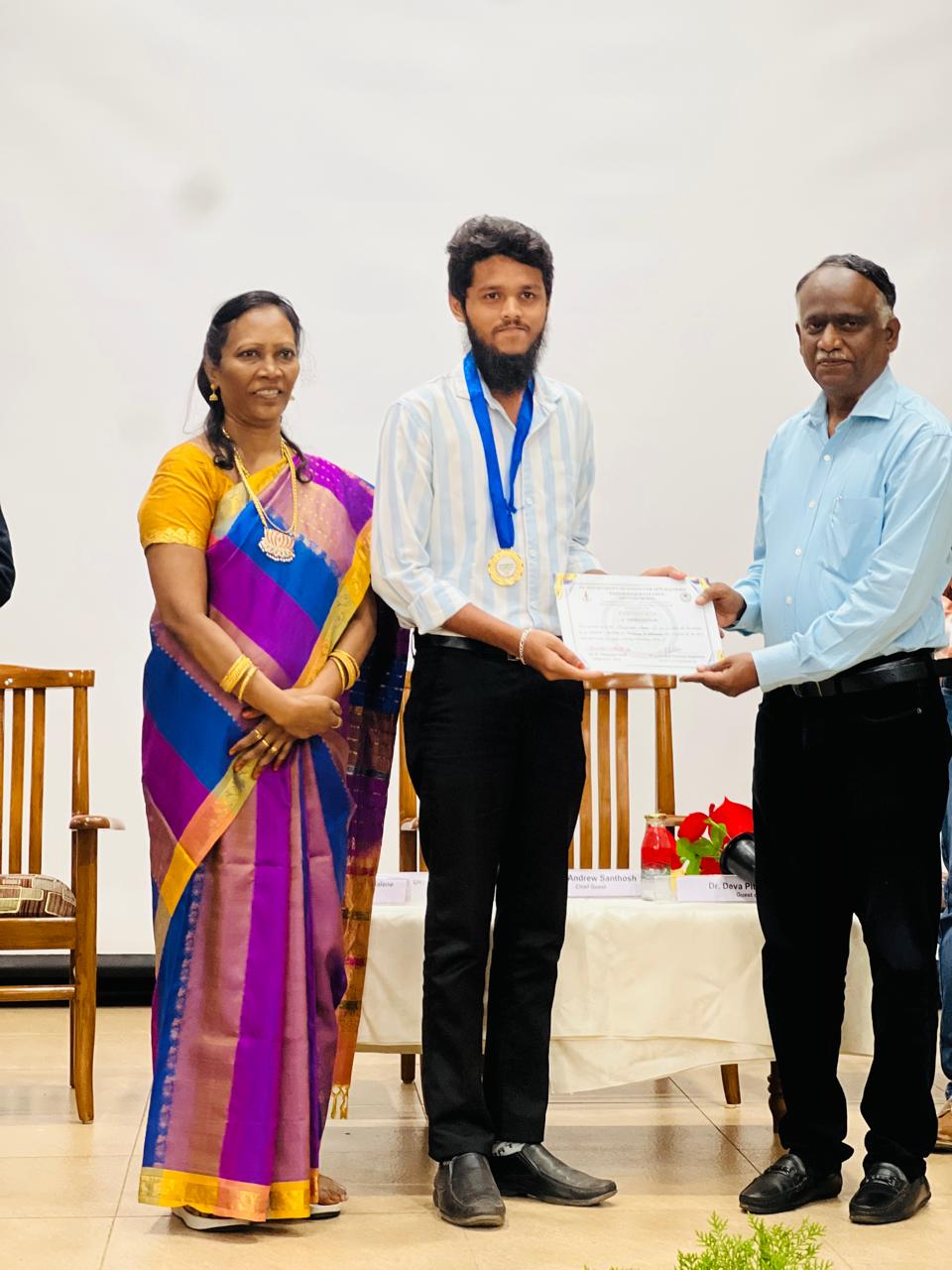 Receiving first prize at the Bishop Heber College MCA programming competition
